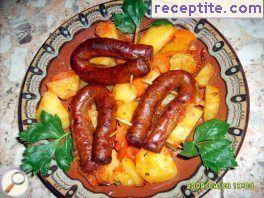 Thin sausage with potatoes in the oven