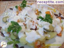 Salad of potatoes, carrots and yogurt sauce