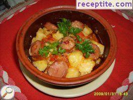 Pots with sausages