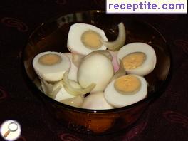 Pickled eggs with onion and garlic