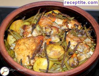 Chicken with vegetables in a pot