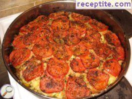 Zucchini with onions and tomatoes in the oven