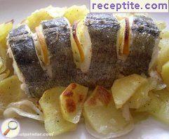Hake with potatoes in the oven