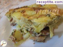 Potatoes with chicken meat and eggs in the oven