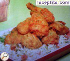 Fried chicken with rice and skinless sausages
