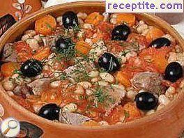 Lamb with beans and olives in a pot