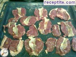 Lamb cutlets with mushrooms in the oven