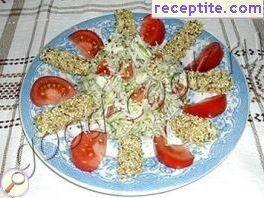 Salad of fresh vegetables with chicken sticks