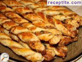 Pretzels puff pastry with olives and cheese