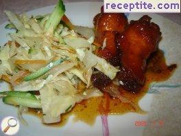 Caramelized chicken with salad