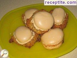 Walnut pastries filled with white glaze Walnut pastries filled with white glaze