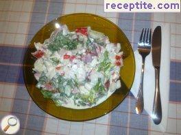 Salad with arugula and crab rolls