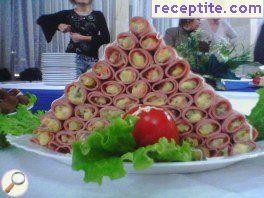 Rolls of ham with Russian salad