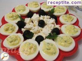 Stuffed eggs with feta cheese and cucumber