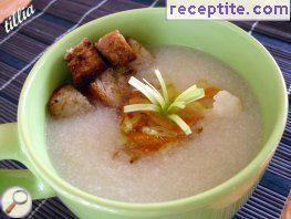 Vegan cauliflower soup with steamed carrots and leeks