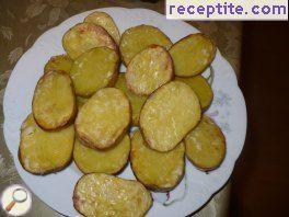 Baked potatoes on salt