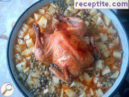 Bake a whole chicken with vegetables
