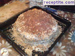 Home layered cake with starch, walnuts and chocolate