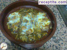 Steaks in the oven with mushrooms and wine