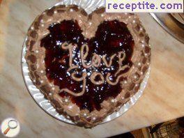 Chocolate layered cake with icing and strawberry jam