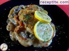Fish with potatoes and mushroom sauce in the oven