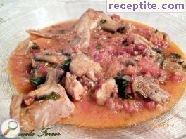 Rabbit with tomatoes, mushrooms and rosemary