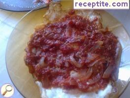 Fried eggs with tomato sauce