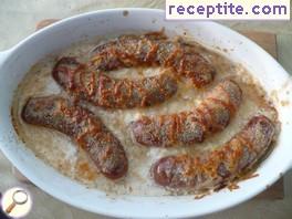 Sausage in the oven with wine sauce