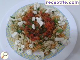 Colorful pasta with tomato sauce