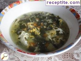 Spinach soup with eggs crossed