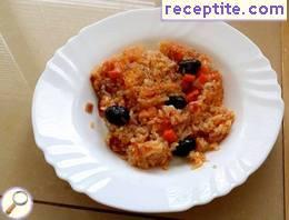 Rice with tomatoes and olives in the oven