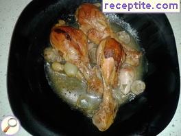 Chicken legs with small onions and mushrooms