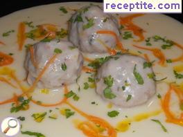 Meatballs in white sauce with orange sauce