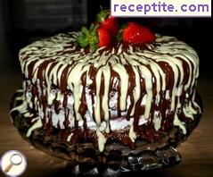 Juicy layered cake with chocolate, strawberries and cream