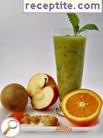 Smoothie with kiwi, orange, apple and dried fruit