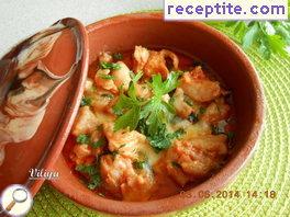 Chicken with onion, pepper and tomato in a pot Chicken with onion, pepper and tomato in a pot