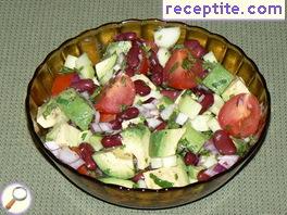 Salad of beans, avocado, cucumber and tomato