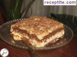 Biscuit layered cake with caramel-cream cream