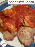 Skalopini with tomato sauce and artichoke