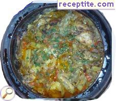 Stewed chicken with vegetables in a pot