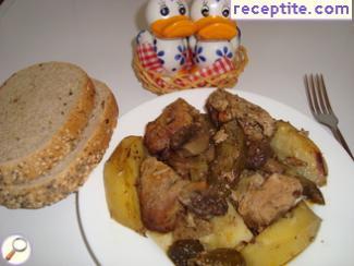 Pork with potatoes and mushrooms in the oven