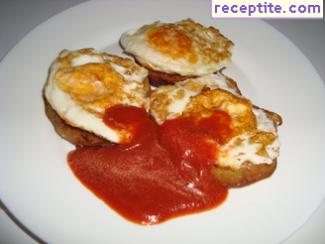 Eggs on fried eggplants