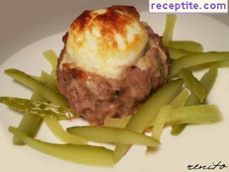 Nests of minced meat with boiled eggs