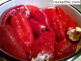 Stuffed peppers with eggs and feta cheese in tomato sauce