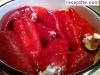 Stuffed peppers with eggs and feta cheese in tomato sauce